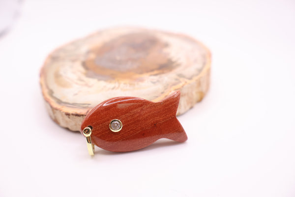 carved gemstone fish pendant