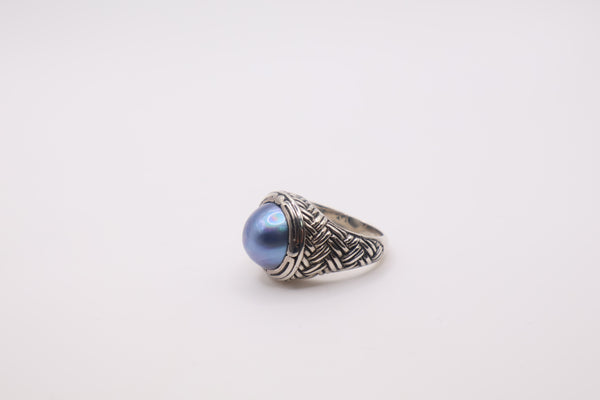 Bali Designs sterling silver ring featuring a round blue cultured mabe pearl set in an ornate, woven band