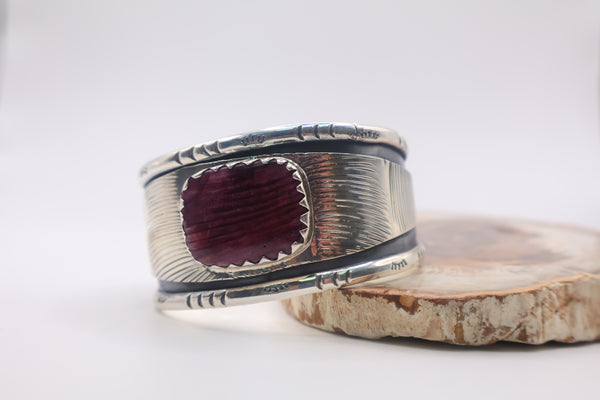 sterling silver cuff bracelet featuring a deep purple spiny oyster shell