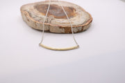 Curved textured 18k gold bar with adjustable sterling silver chain