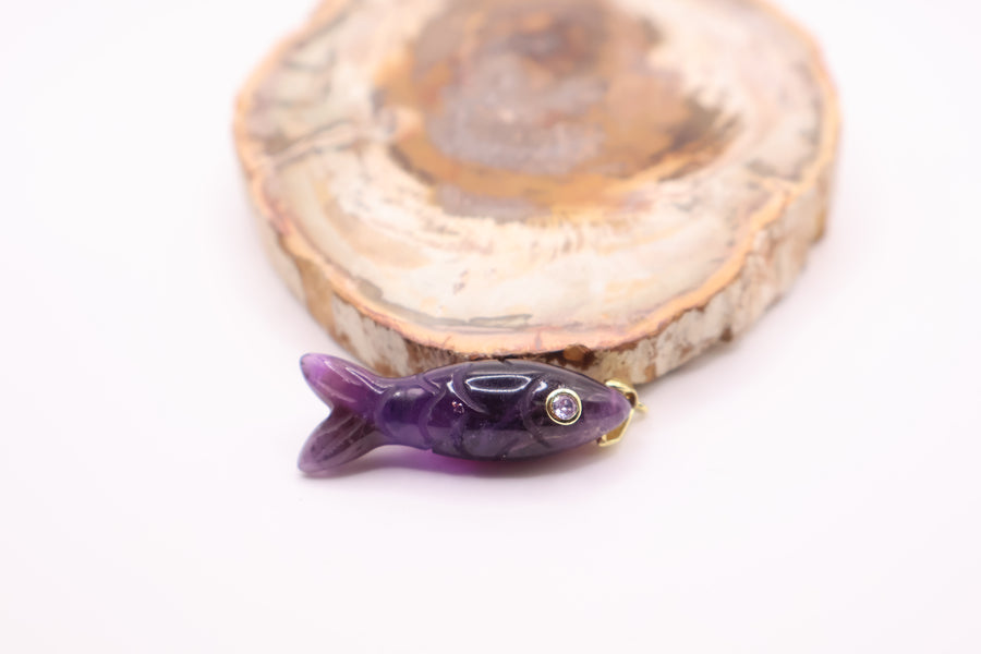 gold and amethyst carved fish pendant