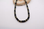 Black beaded necklace with gold accents