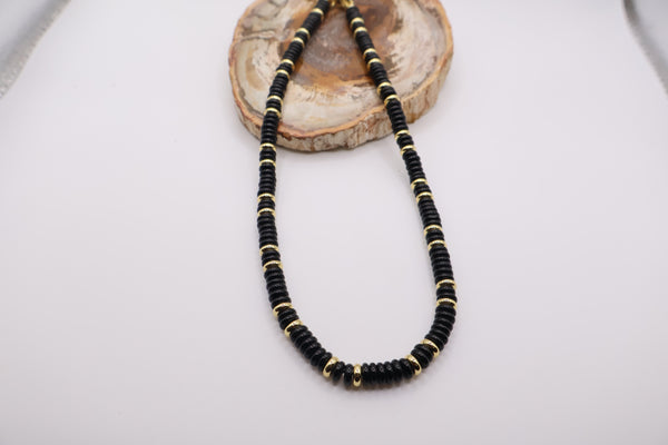 Black beaded necklace with gold accents