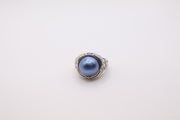 Bali Designs sterling silver ring featuring a round blue cultured mabe pearl set in an ornate, woven band
