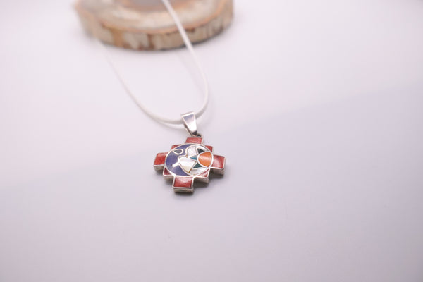 handcrafted 950 silver Chakana pendant featuring a multi-stone inlay of materials like spondylus shell and mother of pear Peruvian inlaid