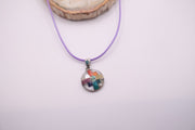 handmade Peruvian 950 silver Chakana pendant featuring a multi-colored stone and abalone inlay