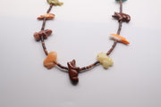 Native American fetish necklace typically made by Navajo or Zuni artists, featuring various hand-carved stone spirit animals