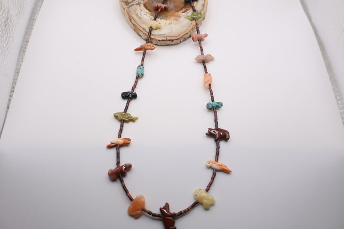 Native American fetish necklace typically made by Navajo or Zuni artists, featuring various hand-carved stone spirit animals