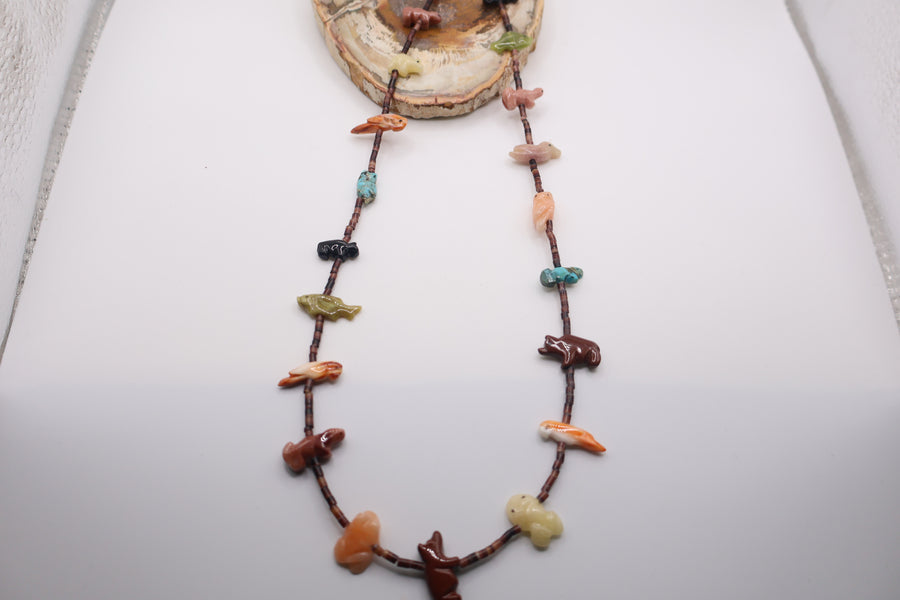 Native American fetish necklace typically made by Navajo or Zuni artists, featuring various hand-carved stone spirit animals