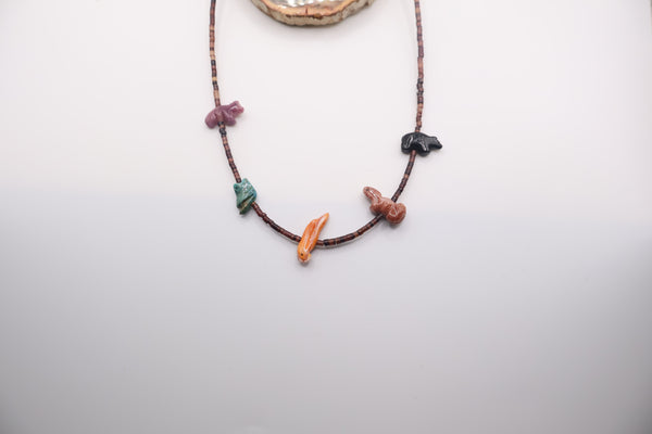 Native American fetish necklace handmade by Navajo artists featuring carved multistone animals on a beaded strand