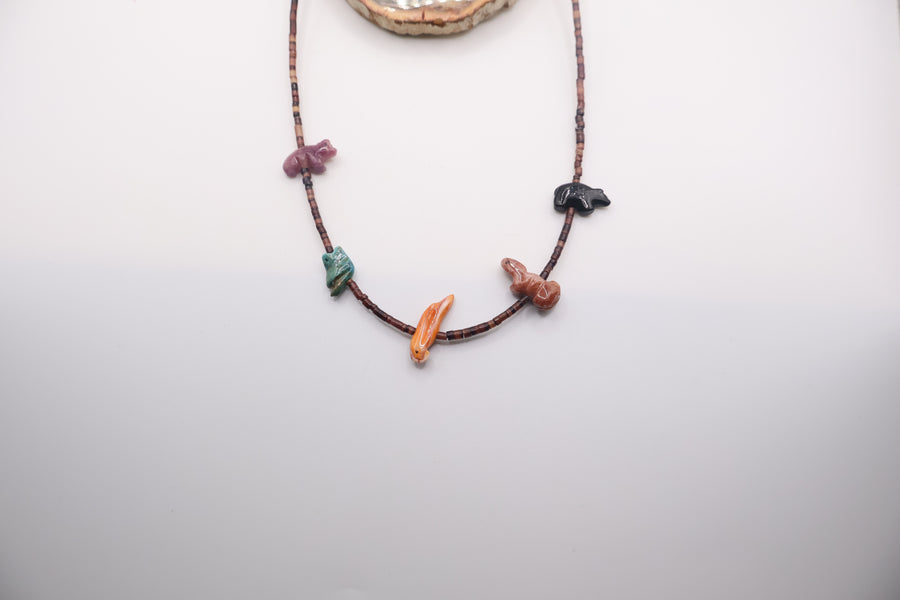Native American fetish necklace handmade by Navajo artists featuring carved multistone animals on a beaded strand