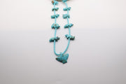 handcrafted Native American-style turquoise fetish necklace featuring hand-carved animal beads and a central eagle necklace