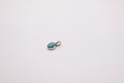 sterling silver pendant features a natural turquoise stone in a bezel setting