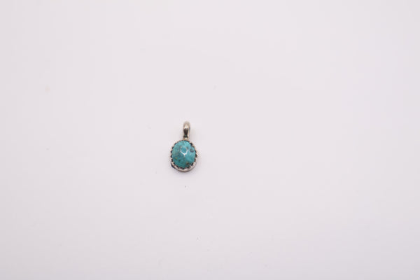 sterling silver pendant features a natural turquoise stone in a bezel setting