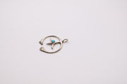 Native American Navajo sterling silver Naja pendant features a small turquoise stone at its center