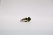Sterling silver two-tone ring features a smooth oval green gemstone ring