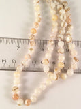 About 58" Long Mother Of Pearl Individually Knotted Continuous Necklace.