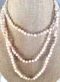 About 58" Long Mother Of Pearl Individually Knotted Continuous Necklace.